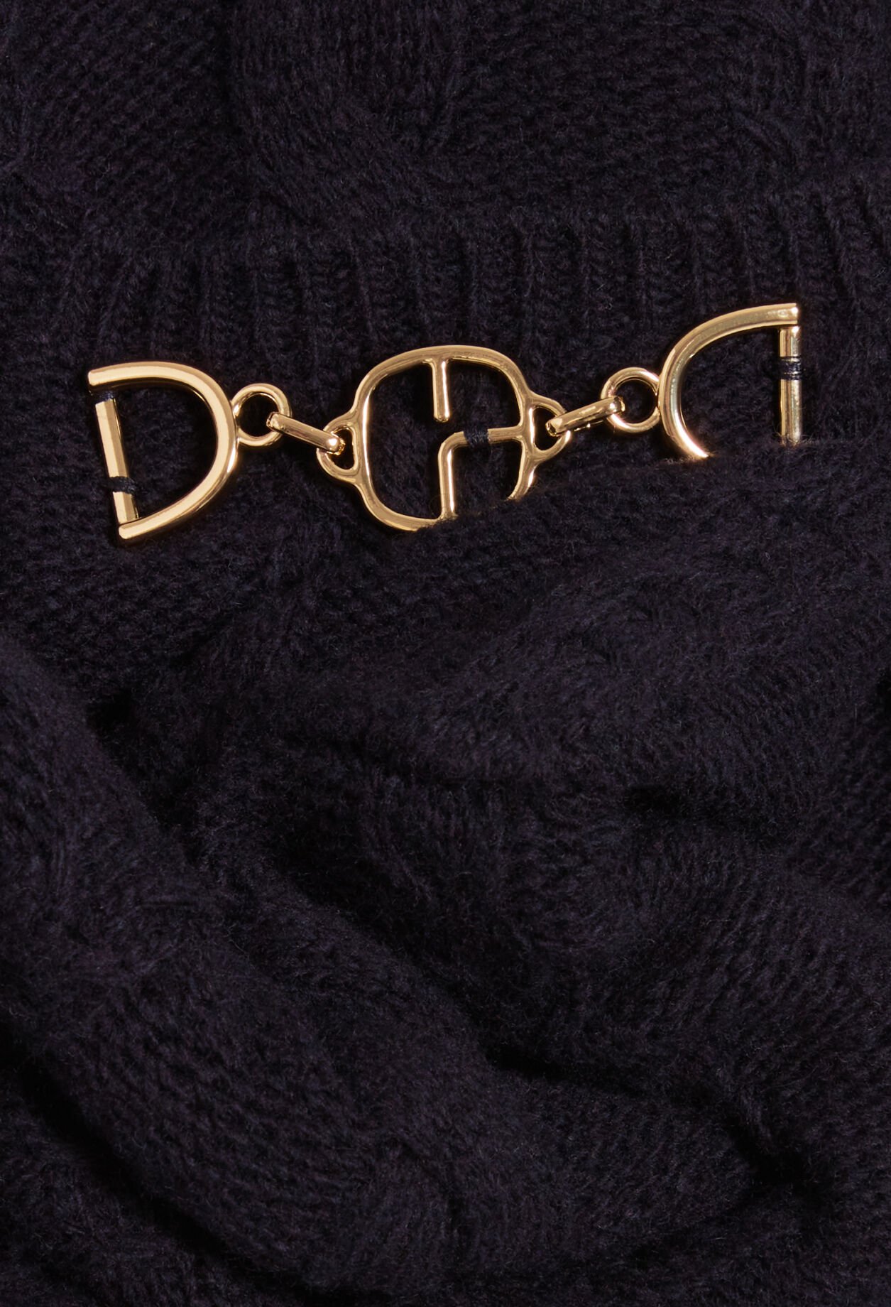 Navy blue cable-knit jumper