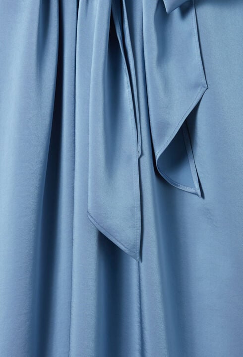 Flowing dress with black bow collar