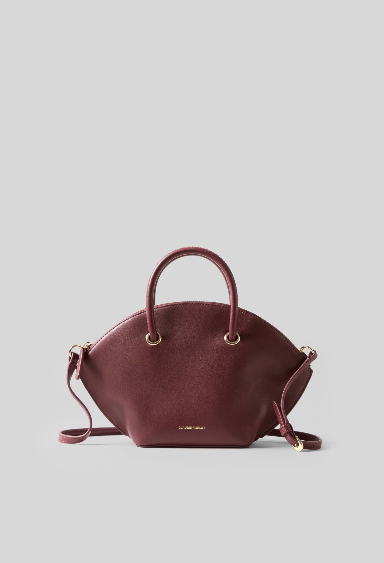 Smooth leather bag with gold rings