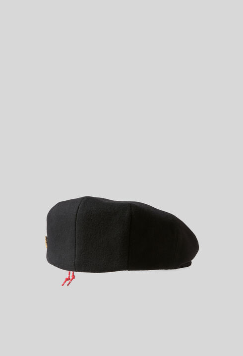 Wool beret with metal brooch