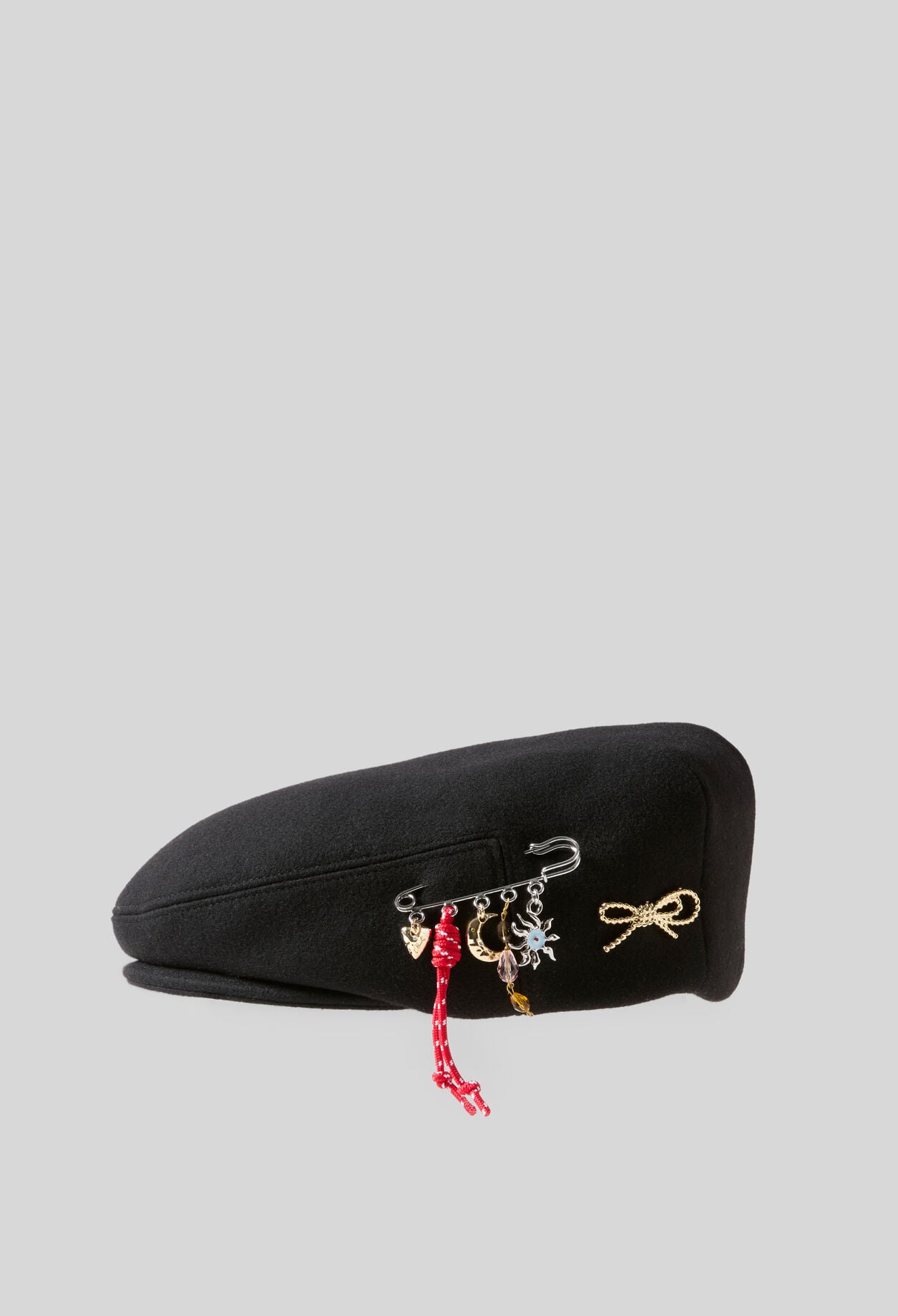 Wool beret with metal brooch