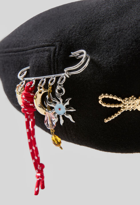 Wool beret with metal brooch