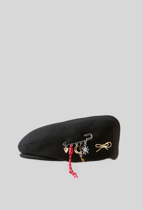 Wool beret with metal brooch