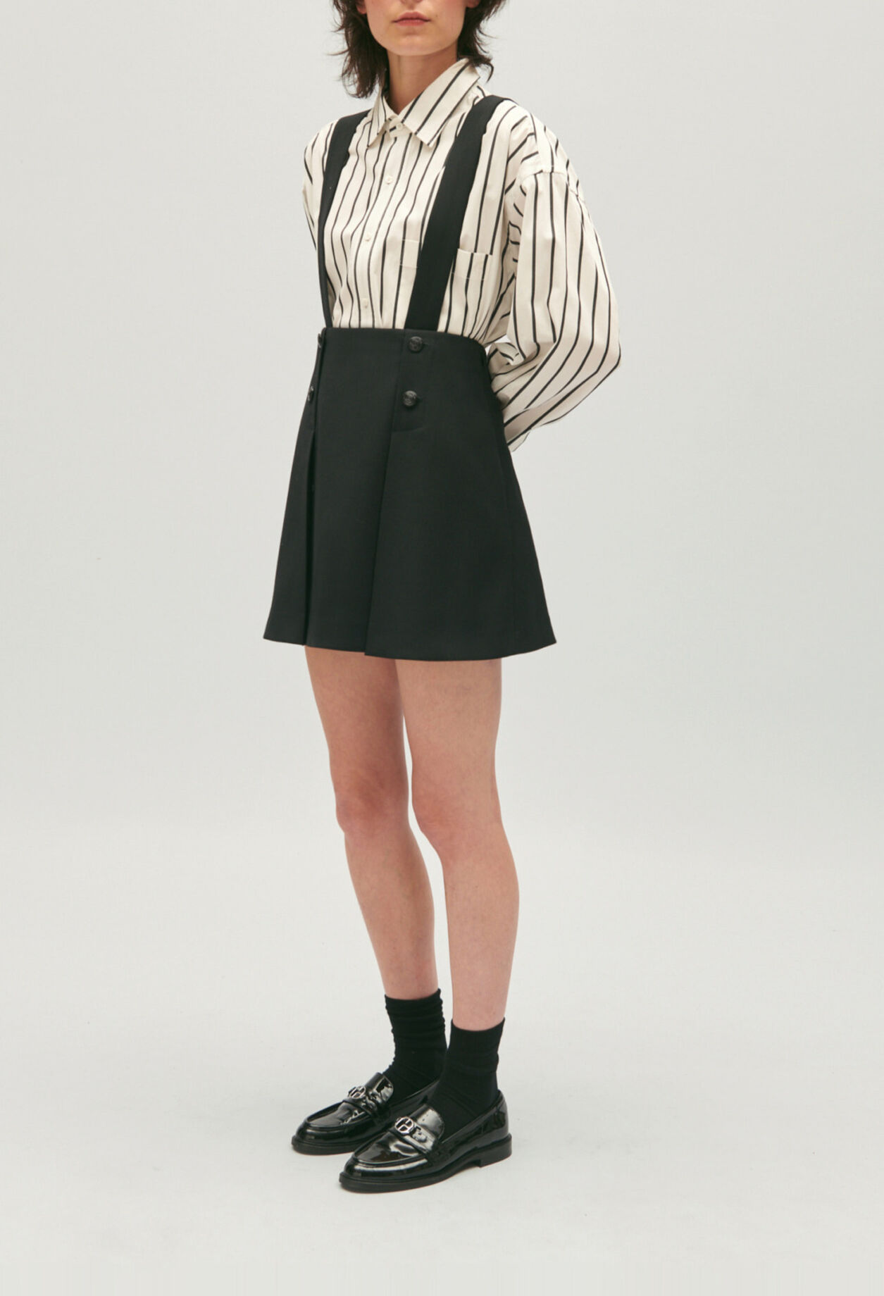 Short black skirt with straps