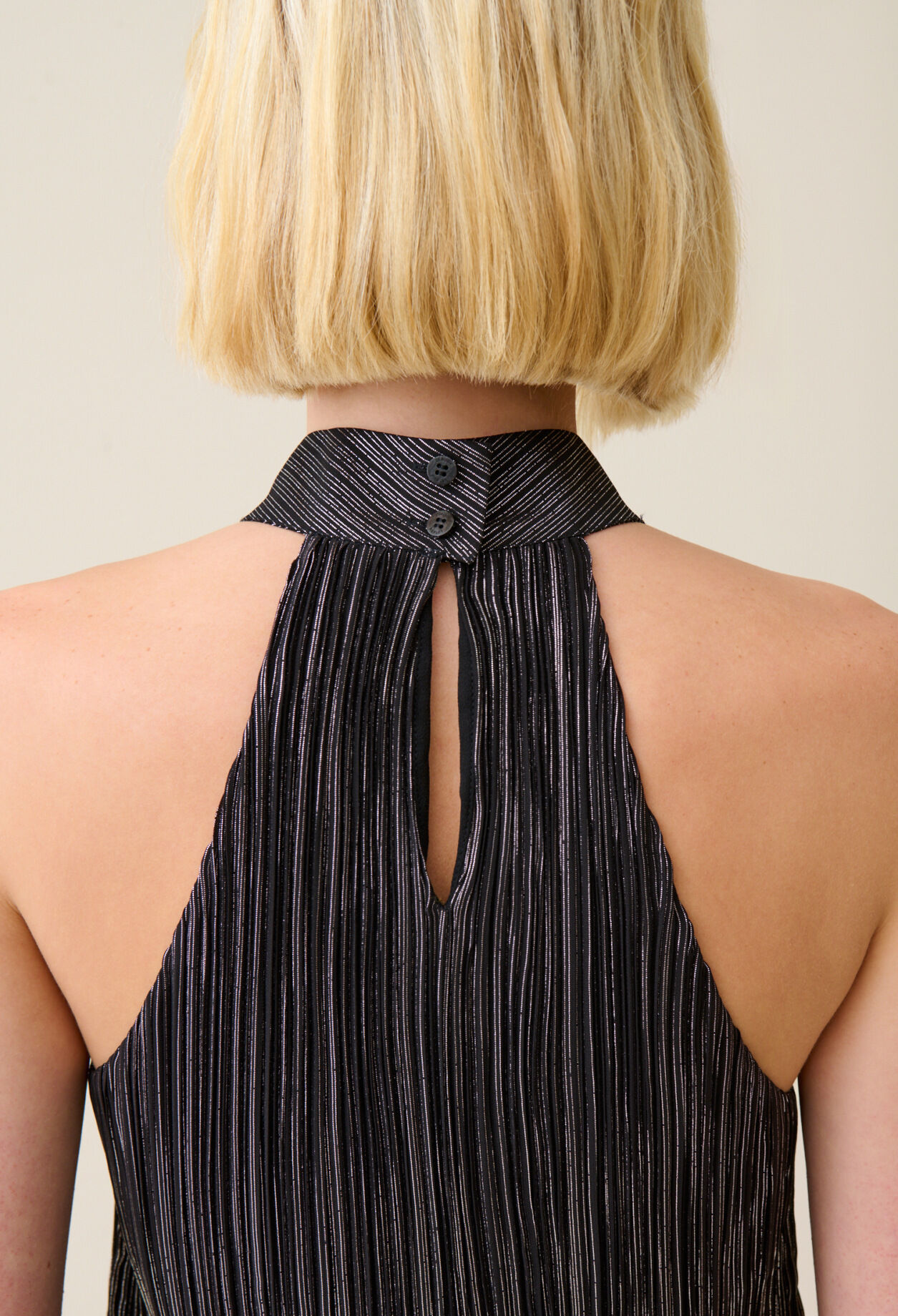 Silver pleated sleeveless top