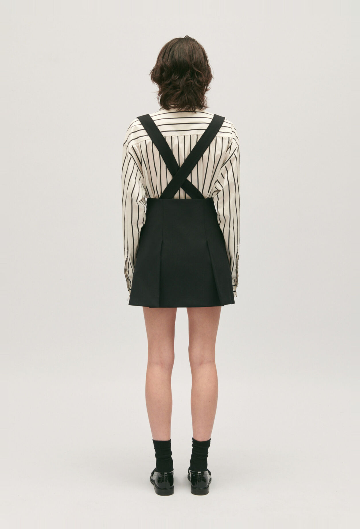 Short black skirt with straps