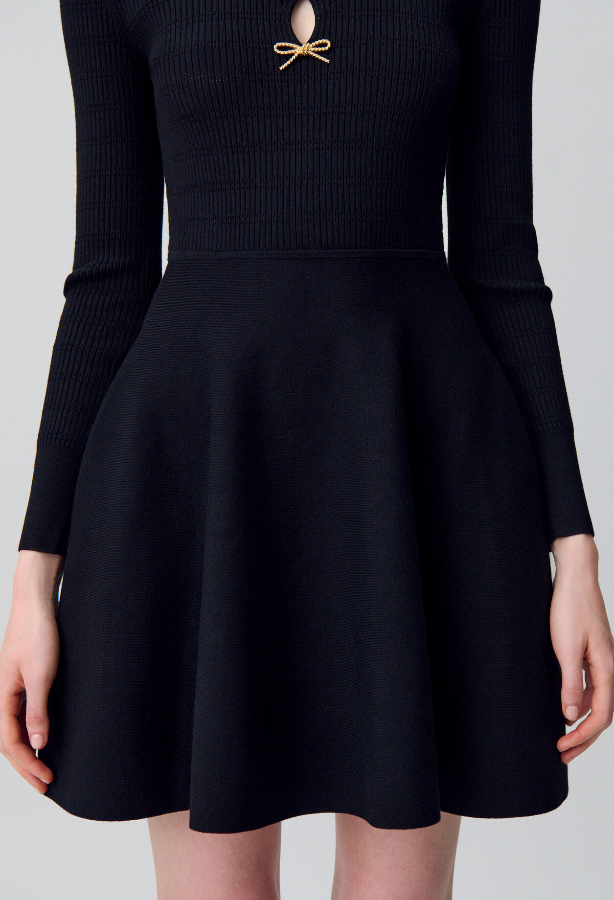 Short knitted dress with knots Short knitted dress with knots