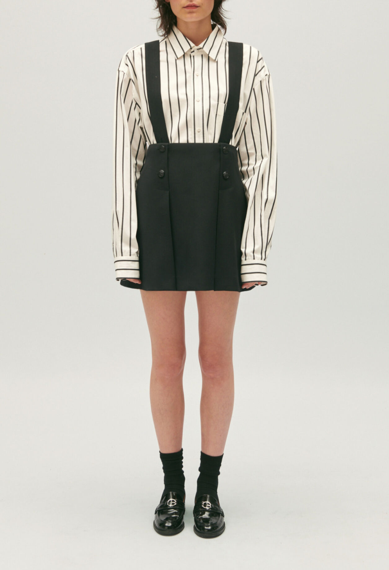 Short black skirt with straps