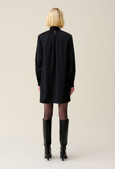 Flowing dress with black bow collar