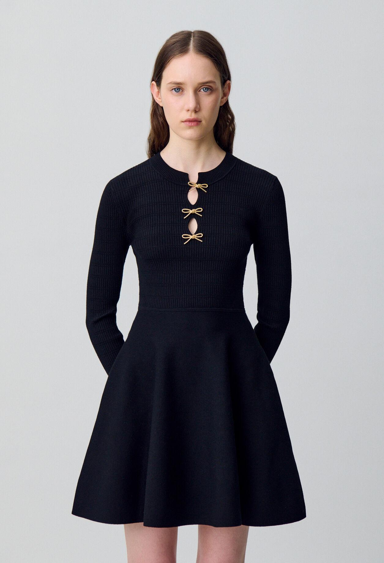Short knitted dress with knots Short knitted dress with knots