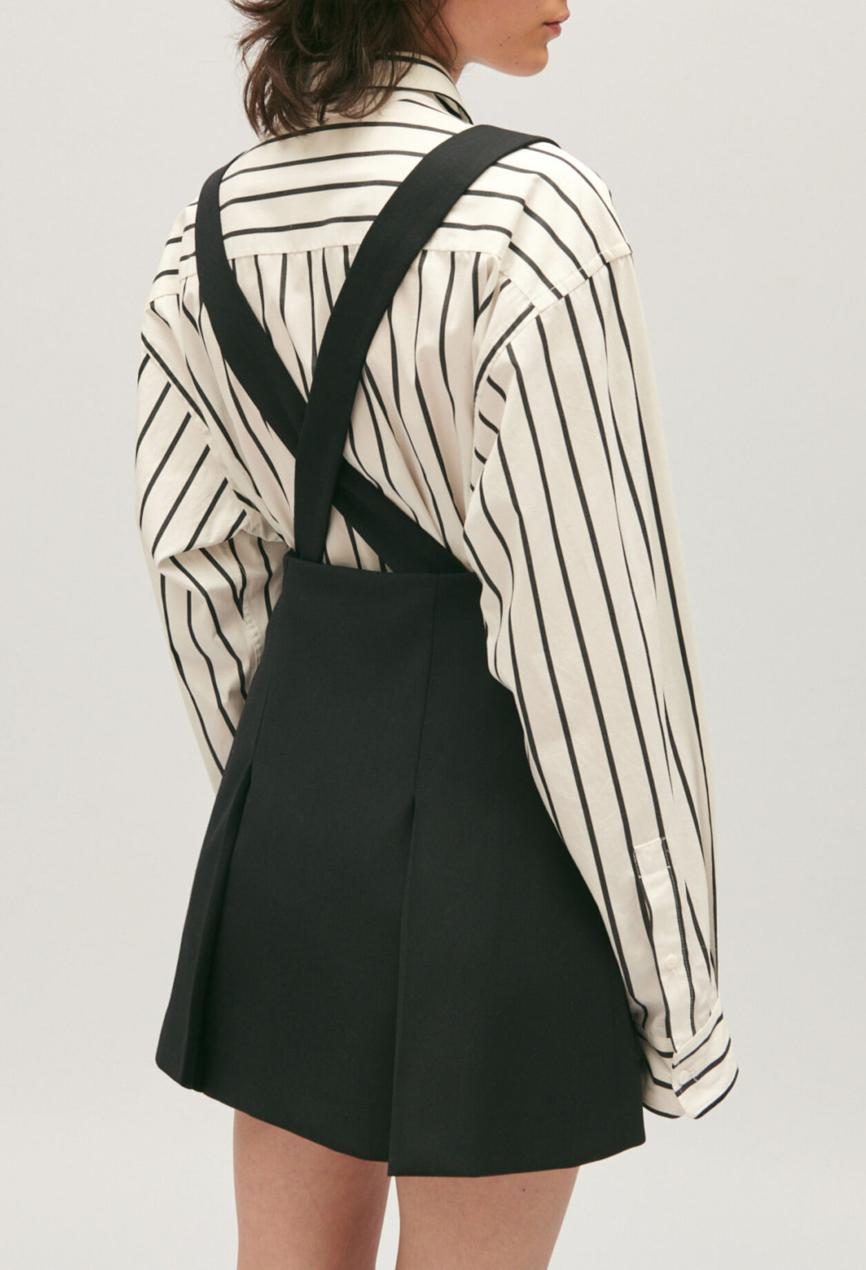 Short black skirt with straps