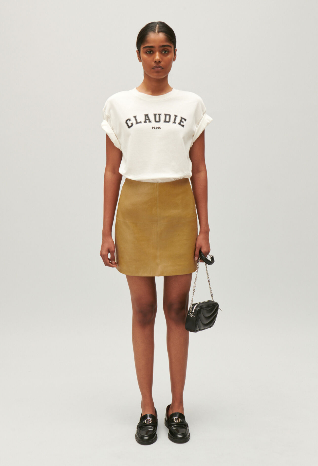 Short ochre yellow leather skirt