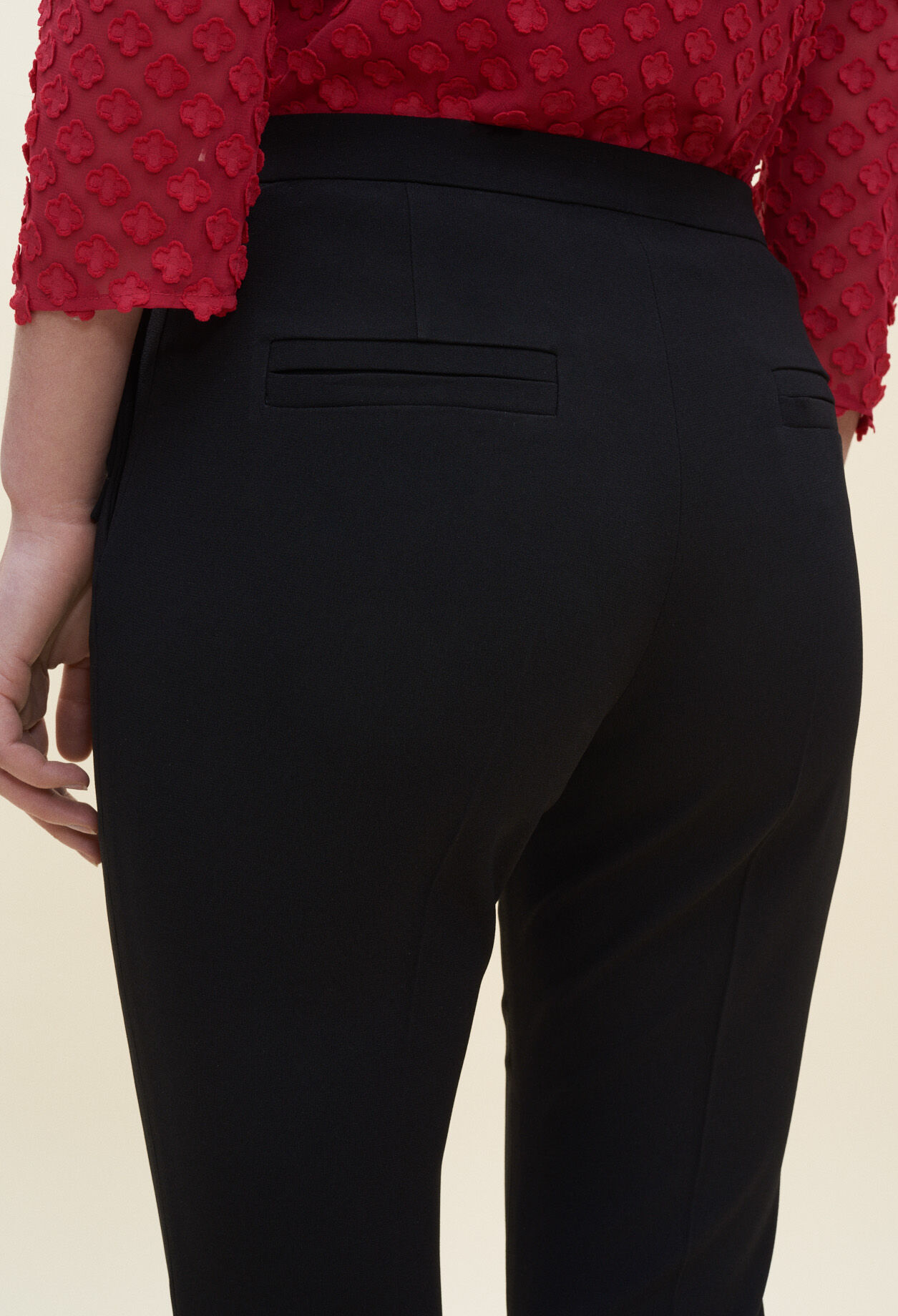 Trousers with bow detail