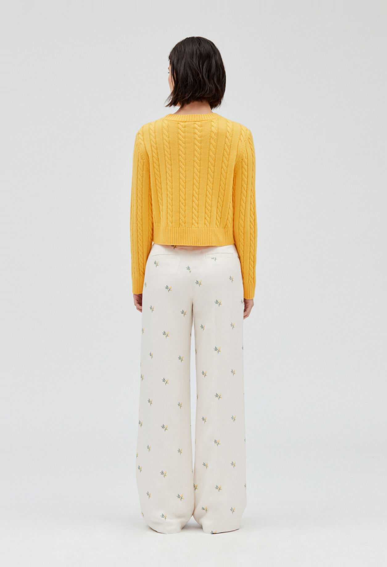 Trousers with embroidered mimosa pattern