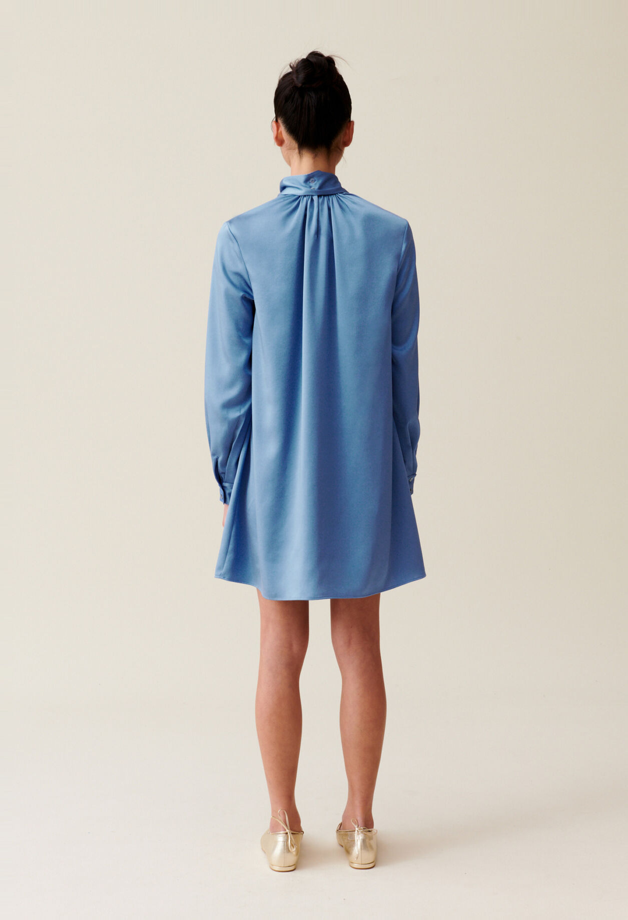 Flowing dress with black bow collar