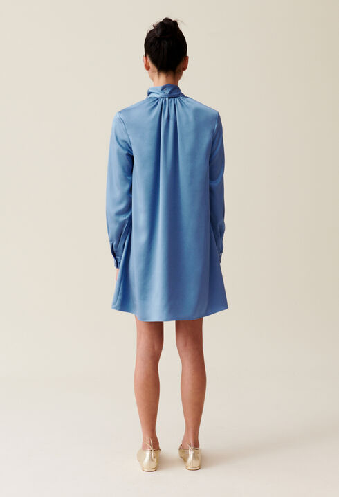 Flowing dress with black bow collar