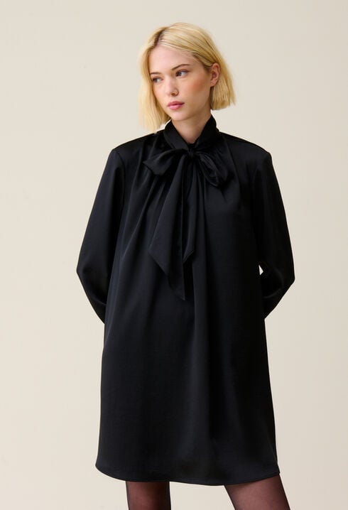 Flowing dress with black bow collar