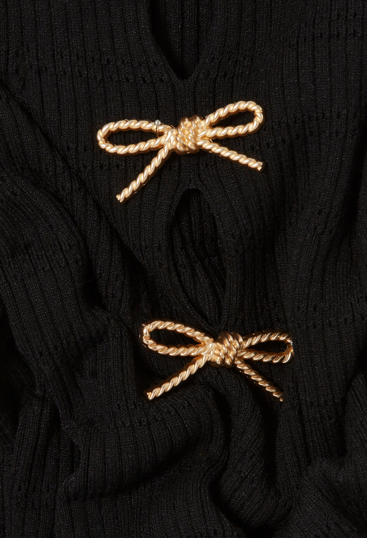 Short knitted dress with knots Short knitted dress with knots