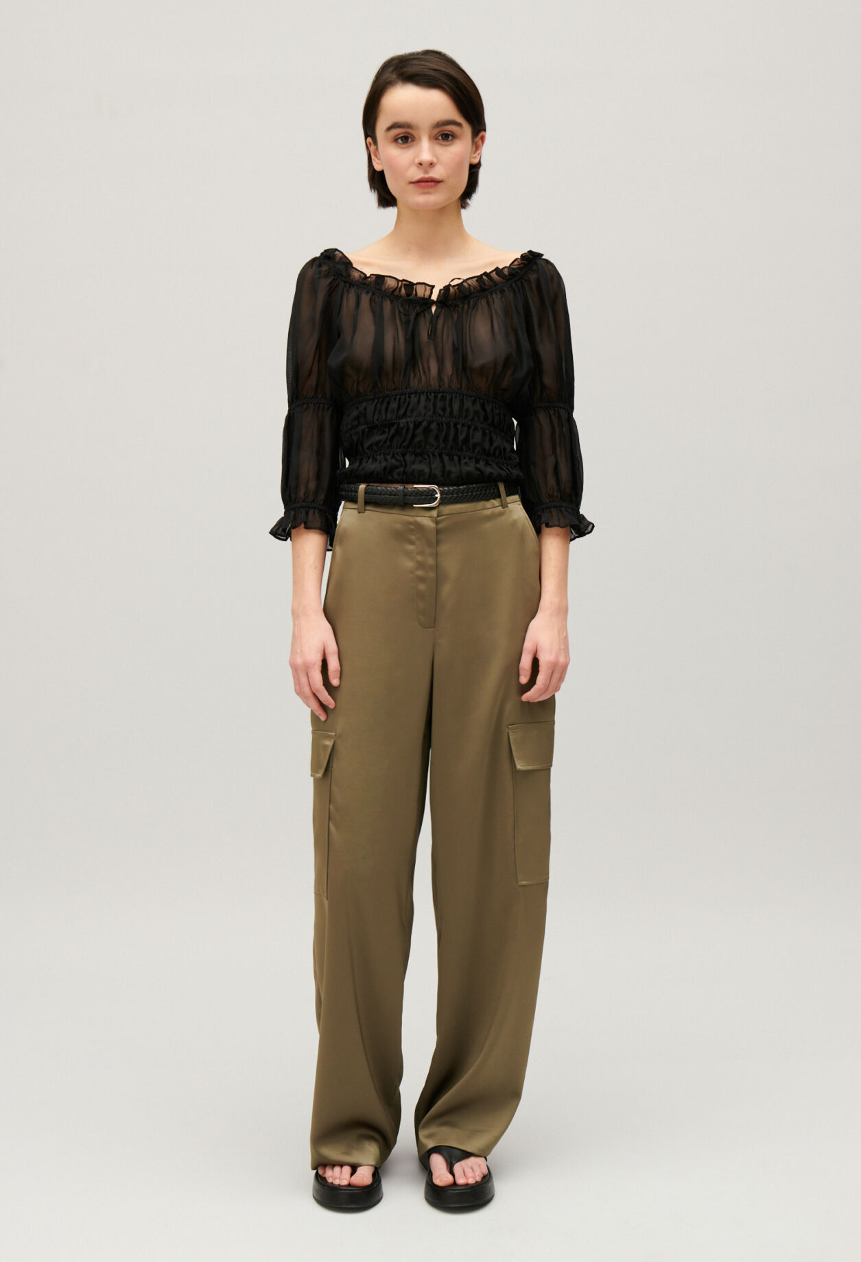 Short black ruffled blouse