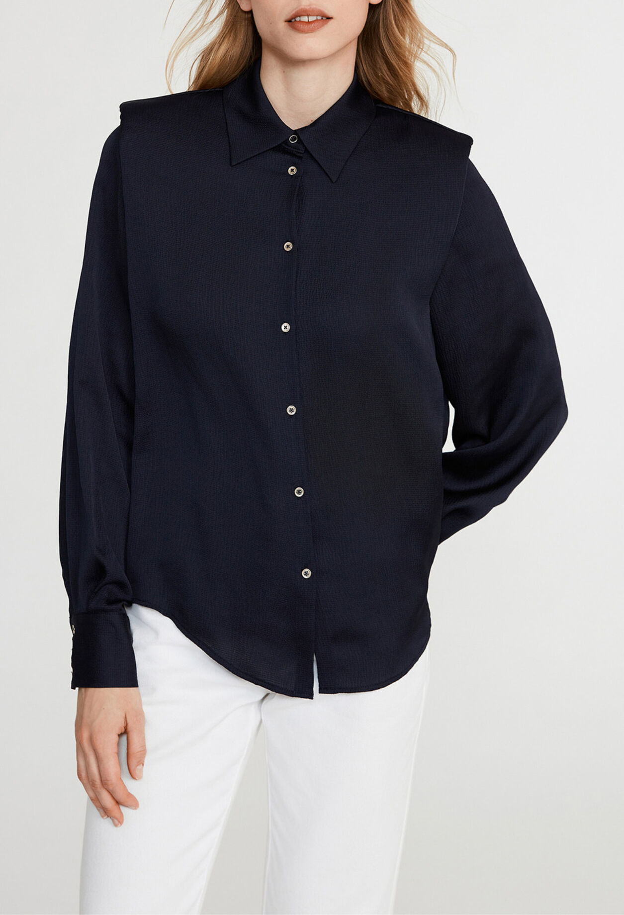Shirt with shoulder pads