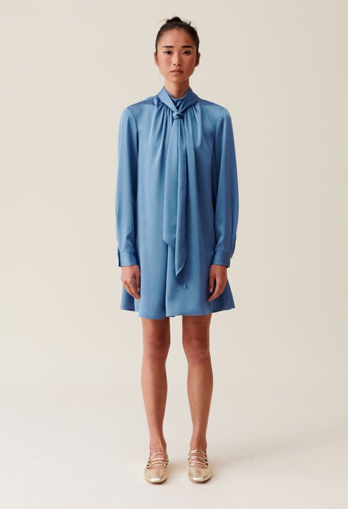 Flowing dress with black bow collar