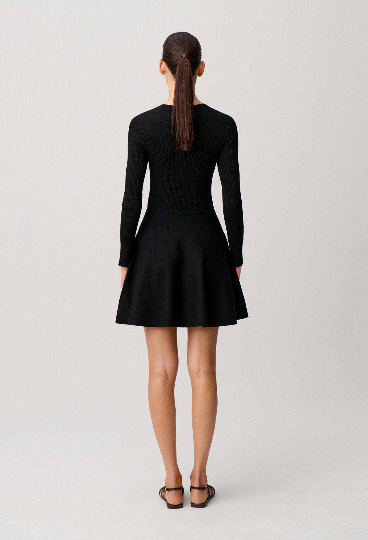 Short knitted dress with knots