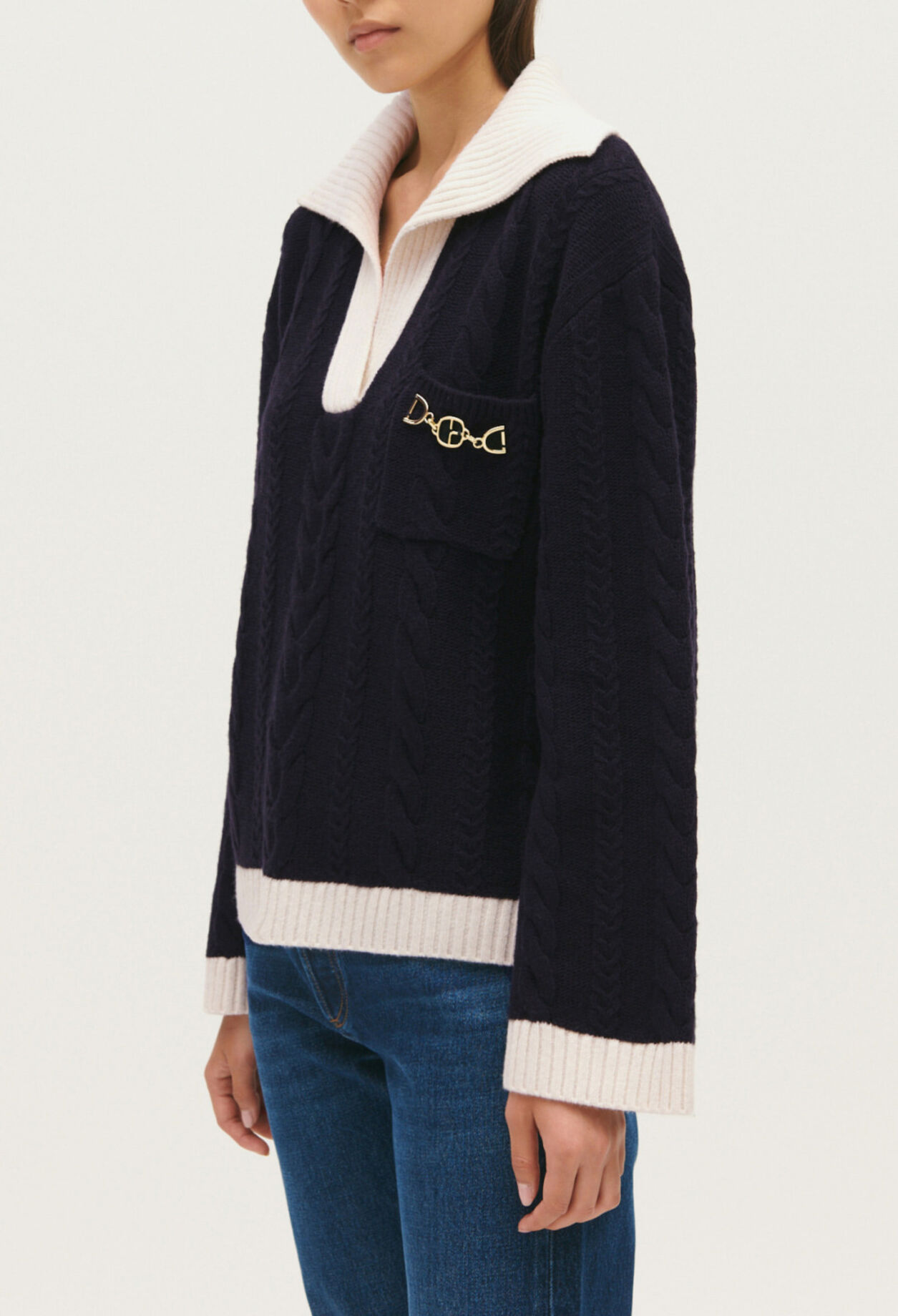 Navy blue cable-knit jumper